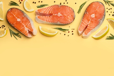 Photo of Flat lay composition with salmon steaks on yellow background. Space for text