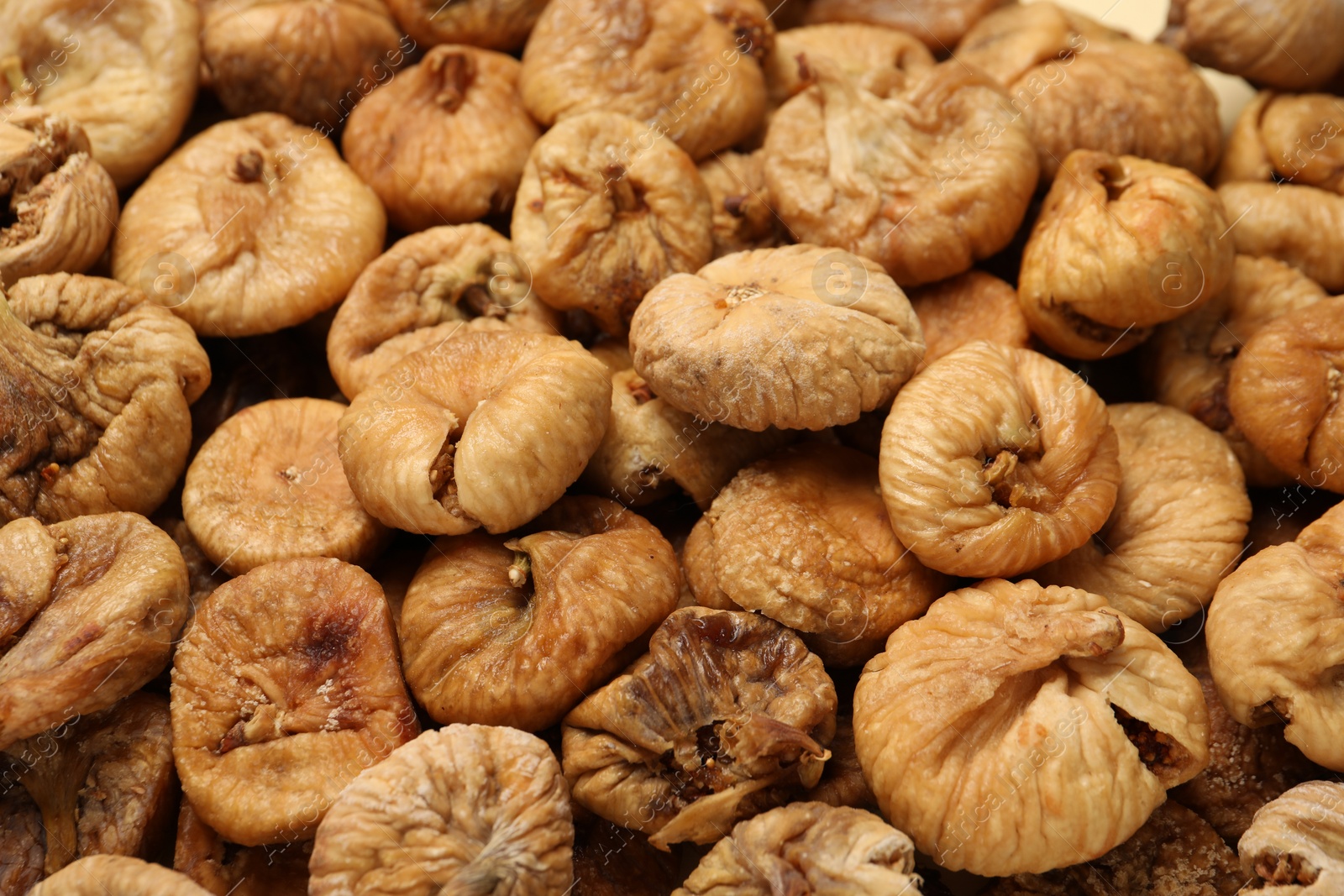 Photo of Many tasty dried figs as background, closeup