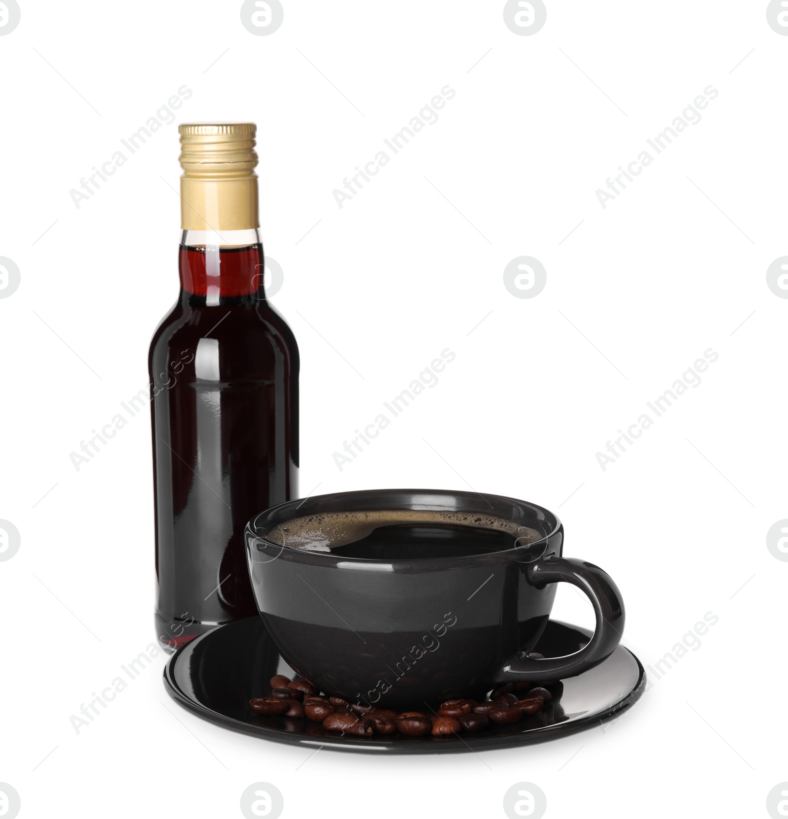 Photo of Bottle of delicious syrup and cup of coffee isolated on white