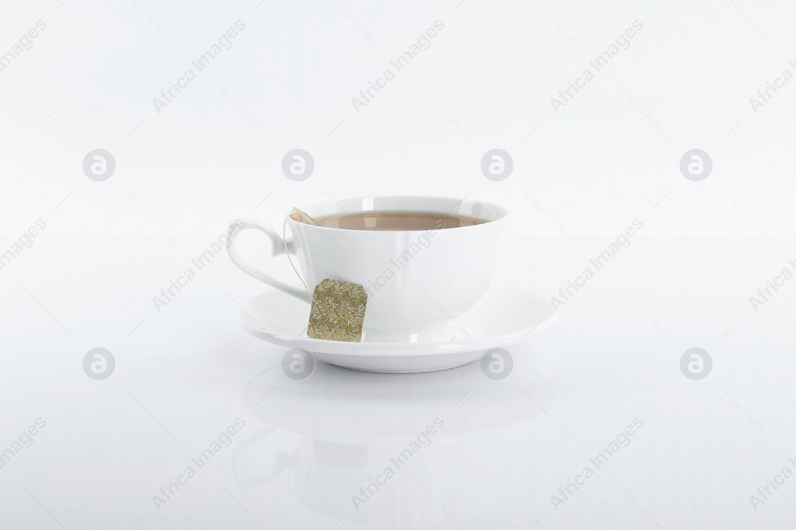 Photo of Tasty tea in cup on white background