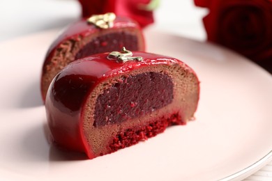 Photo of St. Valentine's Day. Pieces of delicious cake served on table, closeup