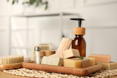 Photo of Eco friendly personal care products on wooden table indoors, space for text