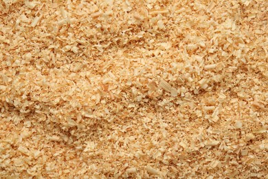 Dry natural sawdust as background, top view