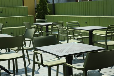 Many chairs and tables at beautiful outdoor cafe