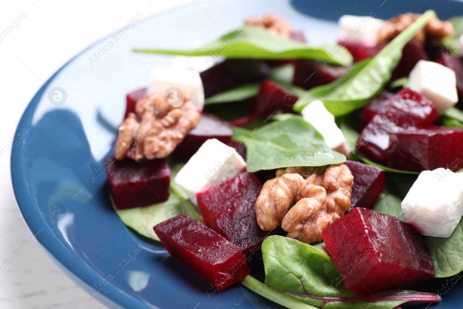 Photo of Fresh delicious beet salad on plate, closeup