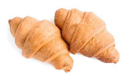 Photo of Tasty fresh crispy croissants isolated on white, top view