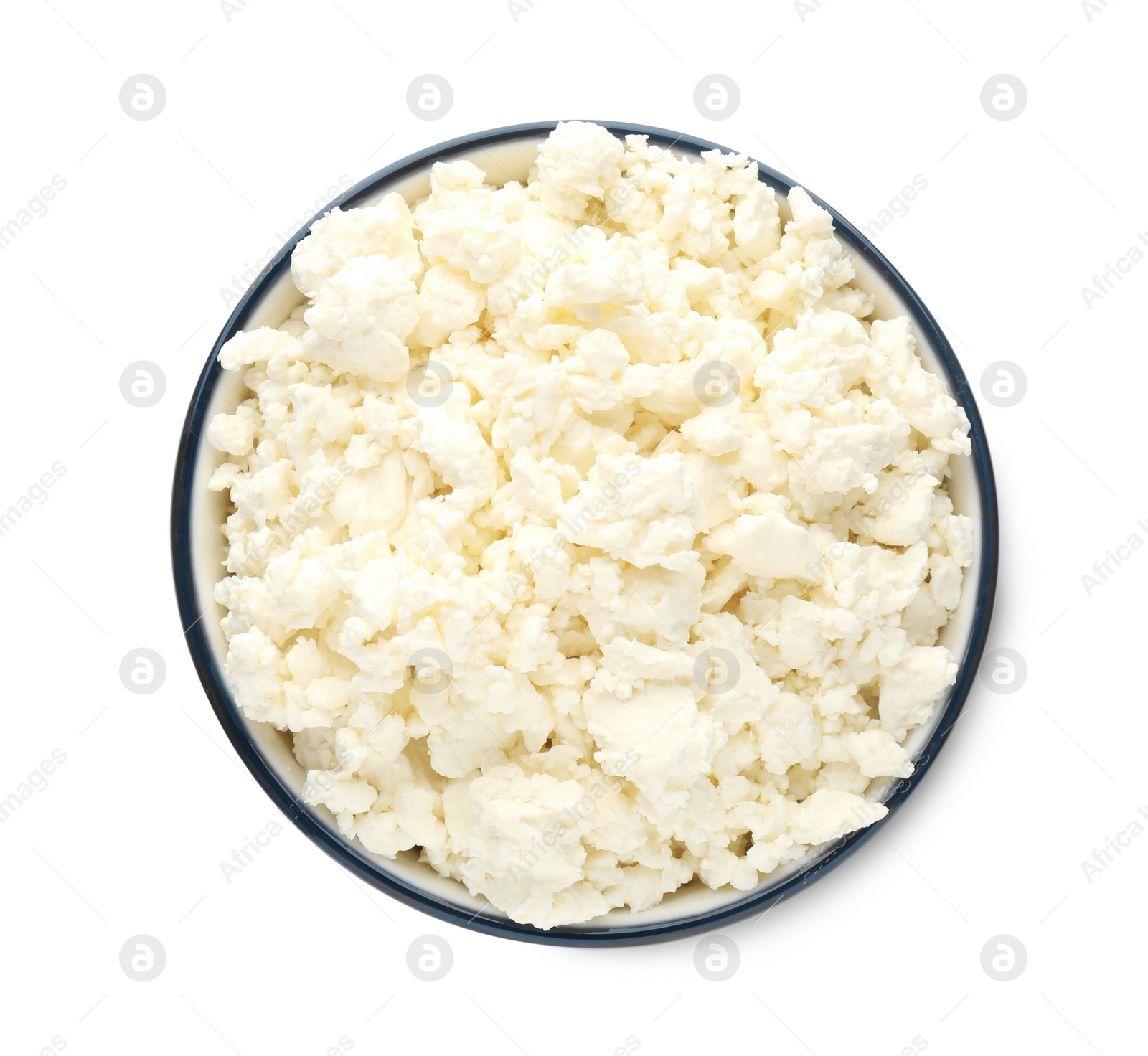 Photo of Delicious fresh cottage cheese in bowl isolated on white, top view