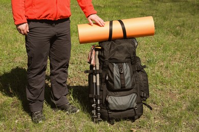 Hiker with backpack ready for journey outdoors, closeup