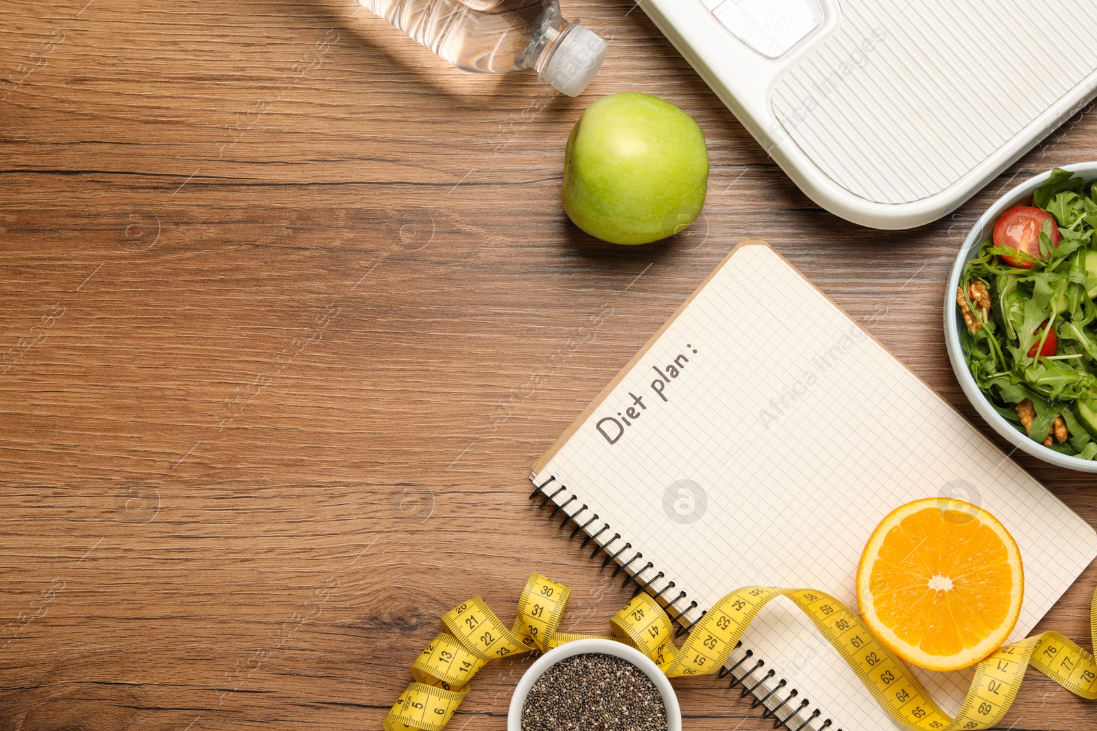 Photo of Weight loss concept. Flat lay composition with notebook, measuring tape and different products on wooden table, space for text