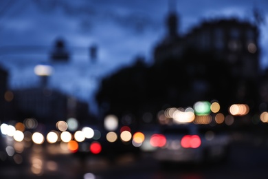 Photo of Blurred view of modern city at evening. Bokeh effect