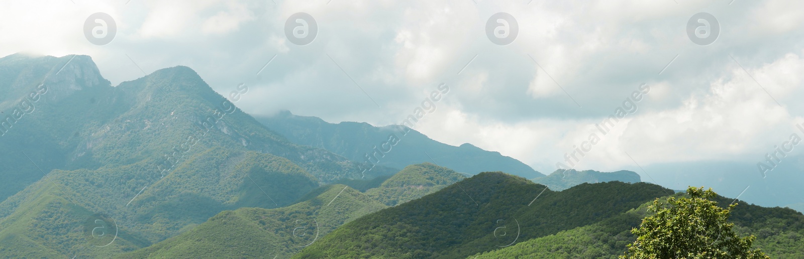 Image of Picturesque mountains under beautiful sky, banner design