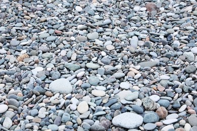 Photo of Surface covered with many different pebbles as background