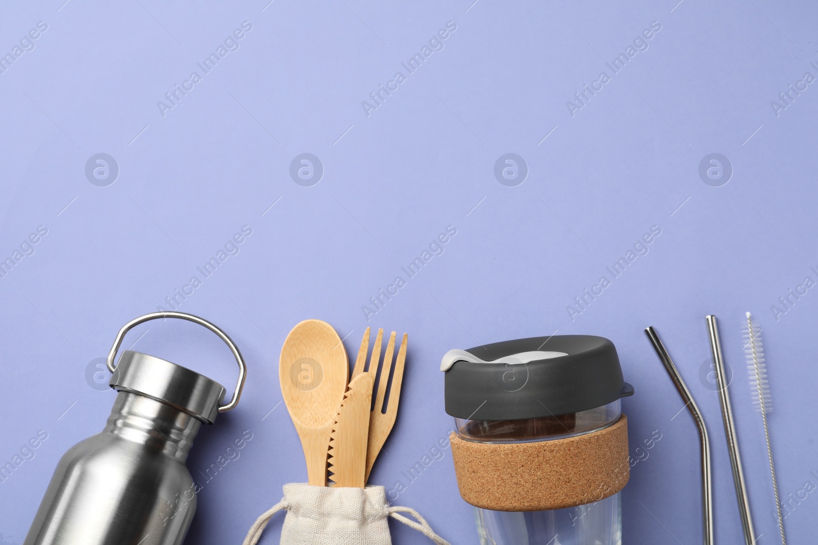 Photo of Flat lay composition with eco friendly products on lavender background, space for text. Conscious consumption