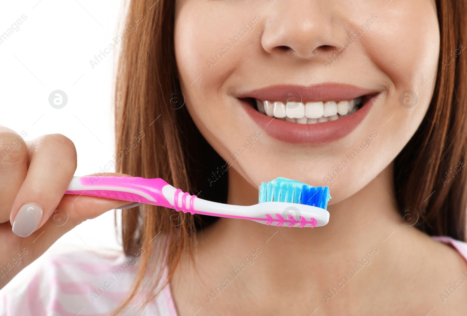 Photo of Beautiful woman brushing teeth on white background, closeup