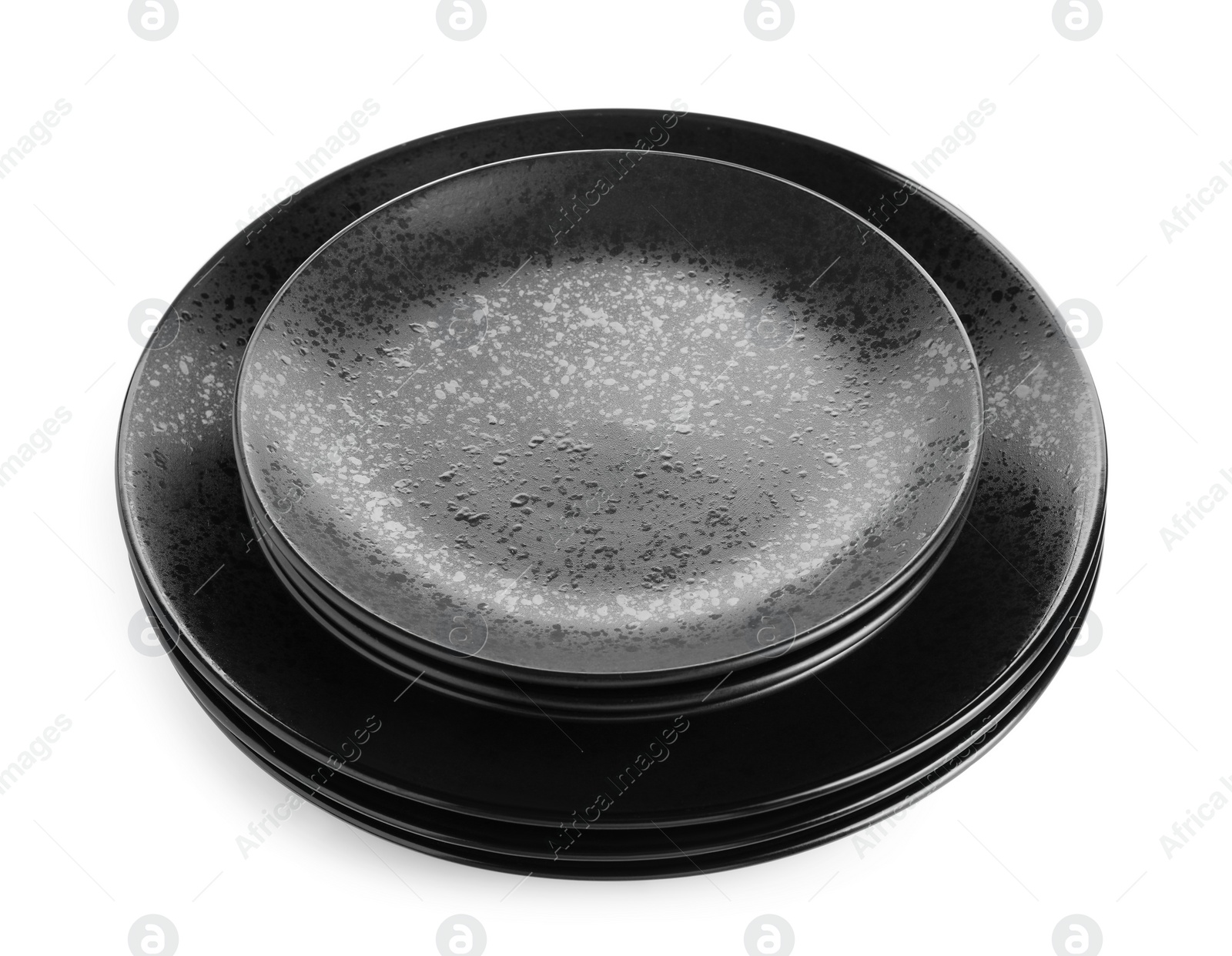 Photo of Stack of black ceramic plates isolated on white