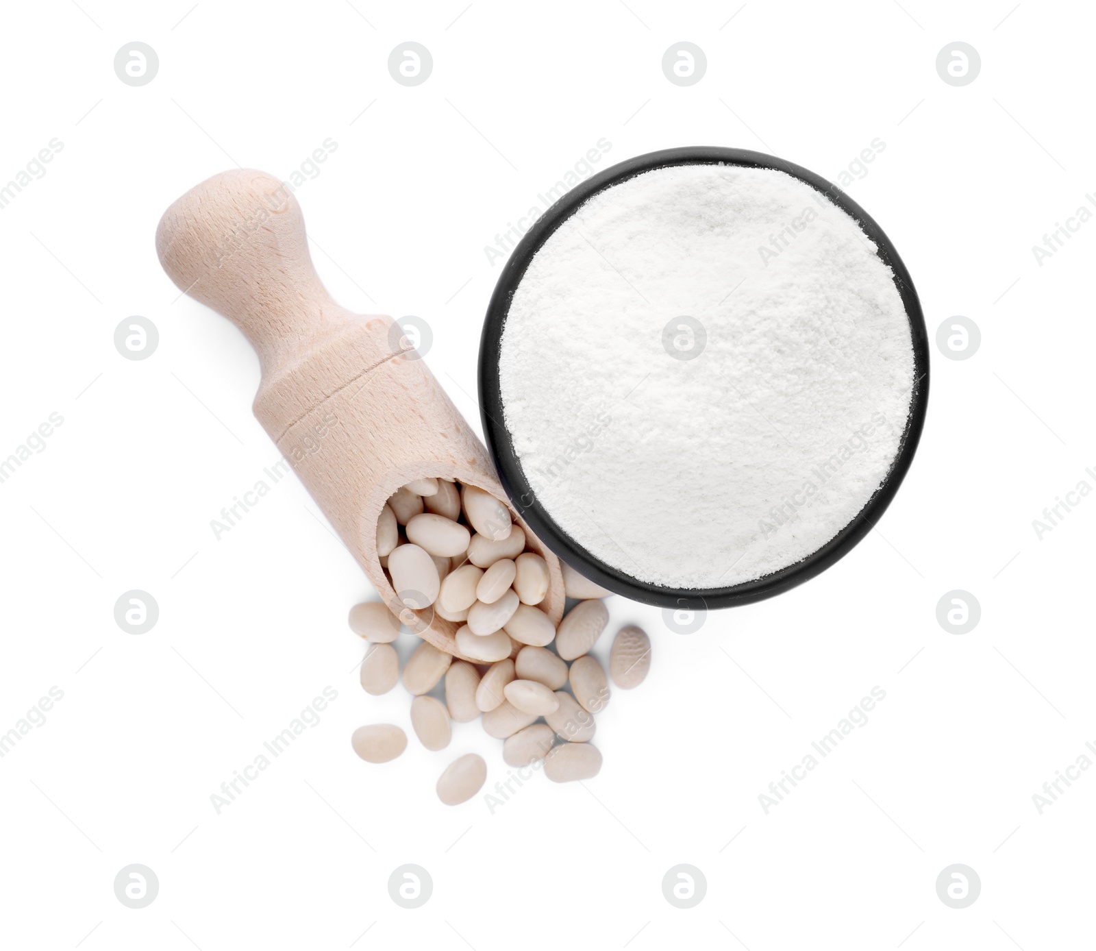 Photo of Bowl with flour, wooden scoop and kidney beans isolated on white, top view