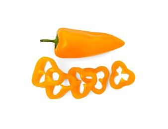 Photo of Cut and whole orange hot chili peppers isolated on white, top view