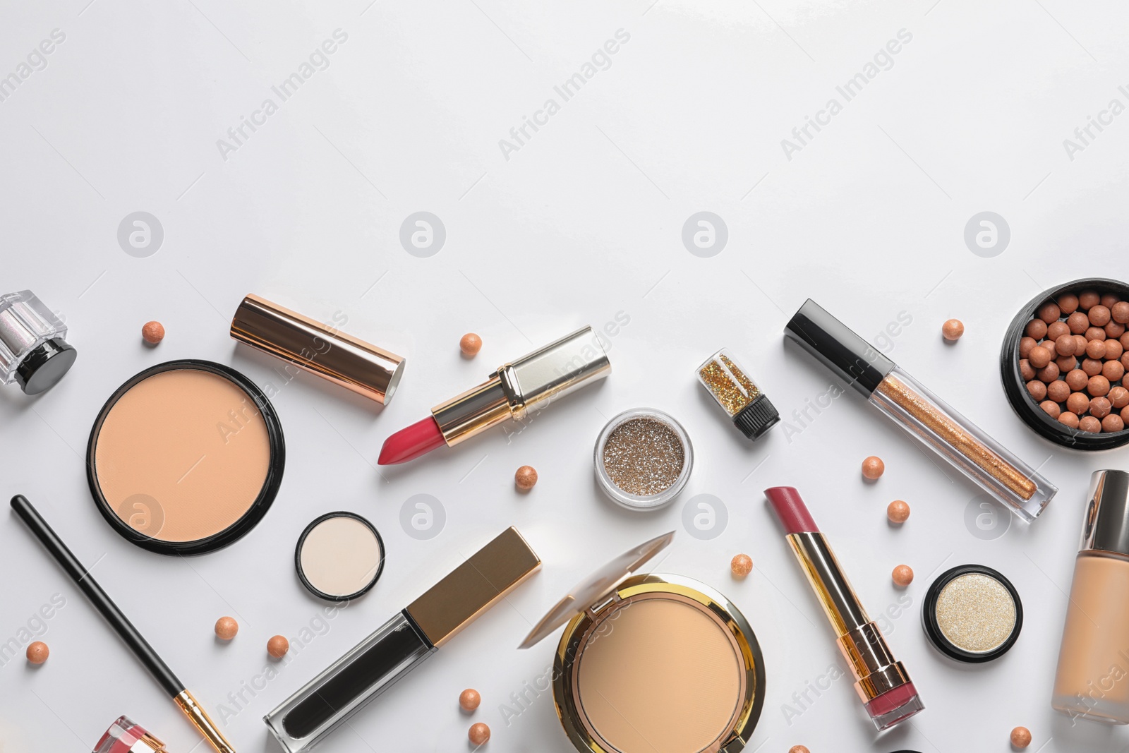 Photo of Different luxury makeup products on white background, top view