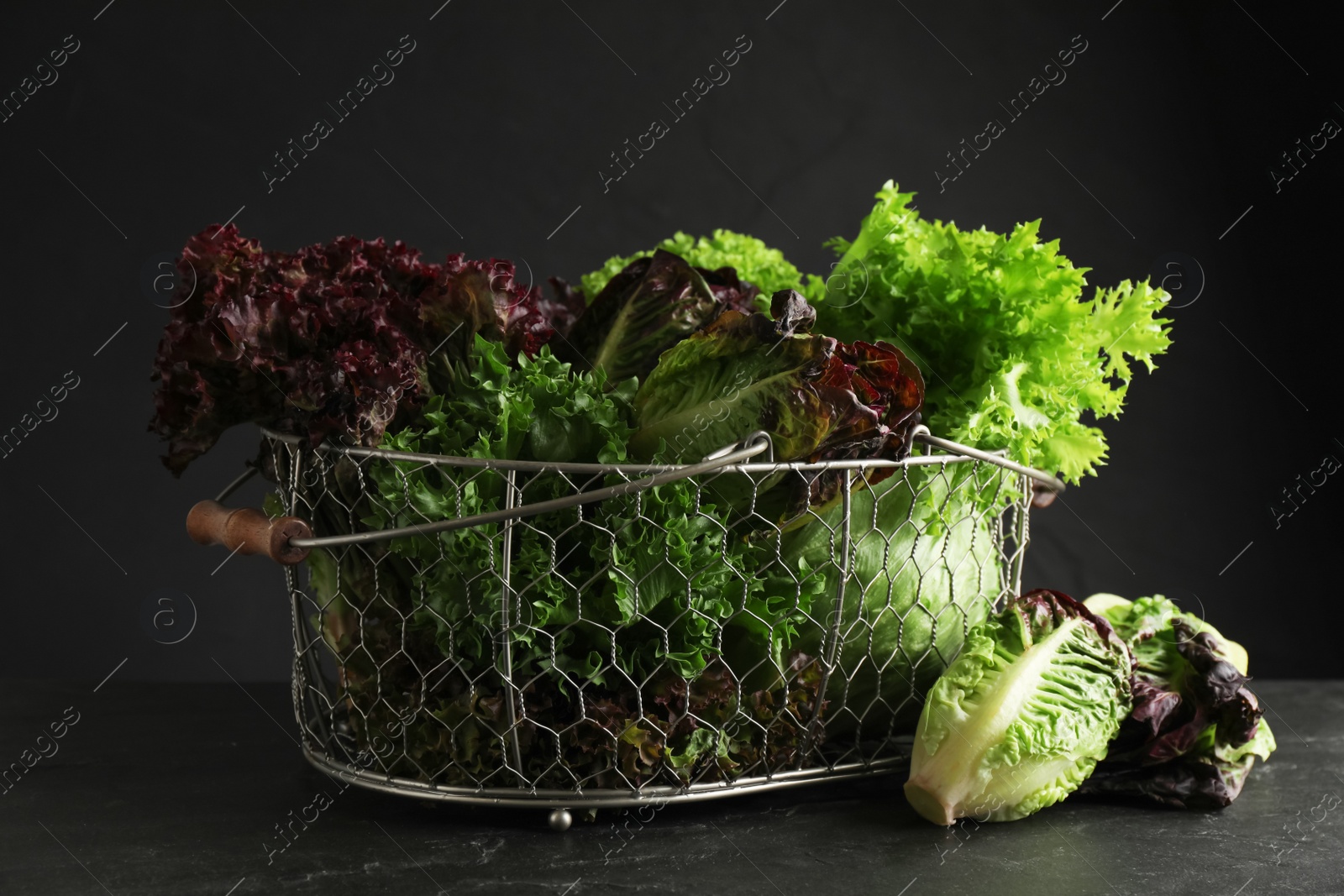 Photo of Different sorts of lettuce on black slate table