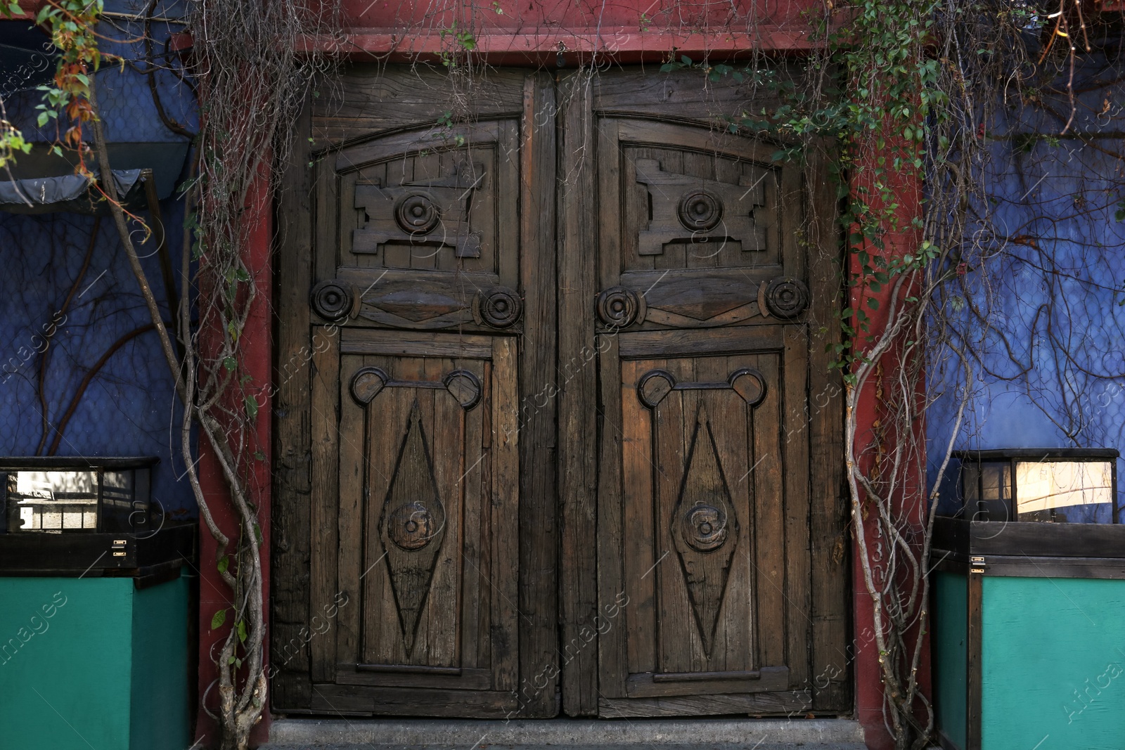 Photo of Beautiful building facade with wooden door outdoors