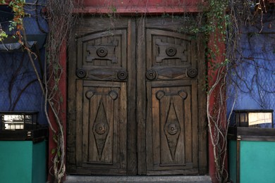 Photo of Beautiful building facade with wooden door outdoors