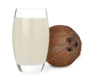 Glass of coconut water and nut isolated on white