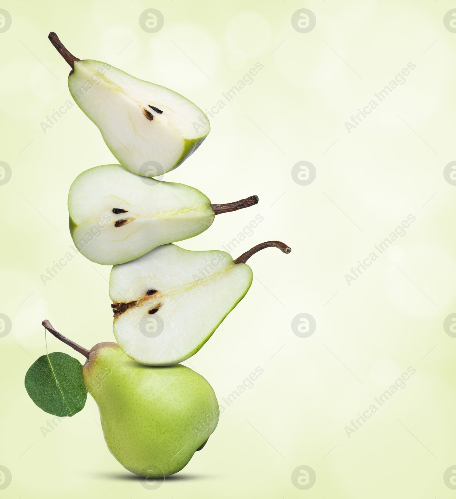 Image of Cut and whole fresh ripe pears on light green gradient background, space for text