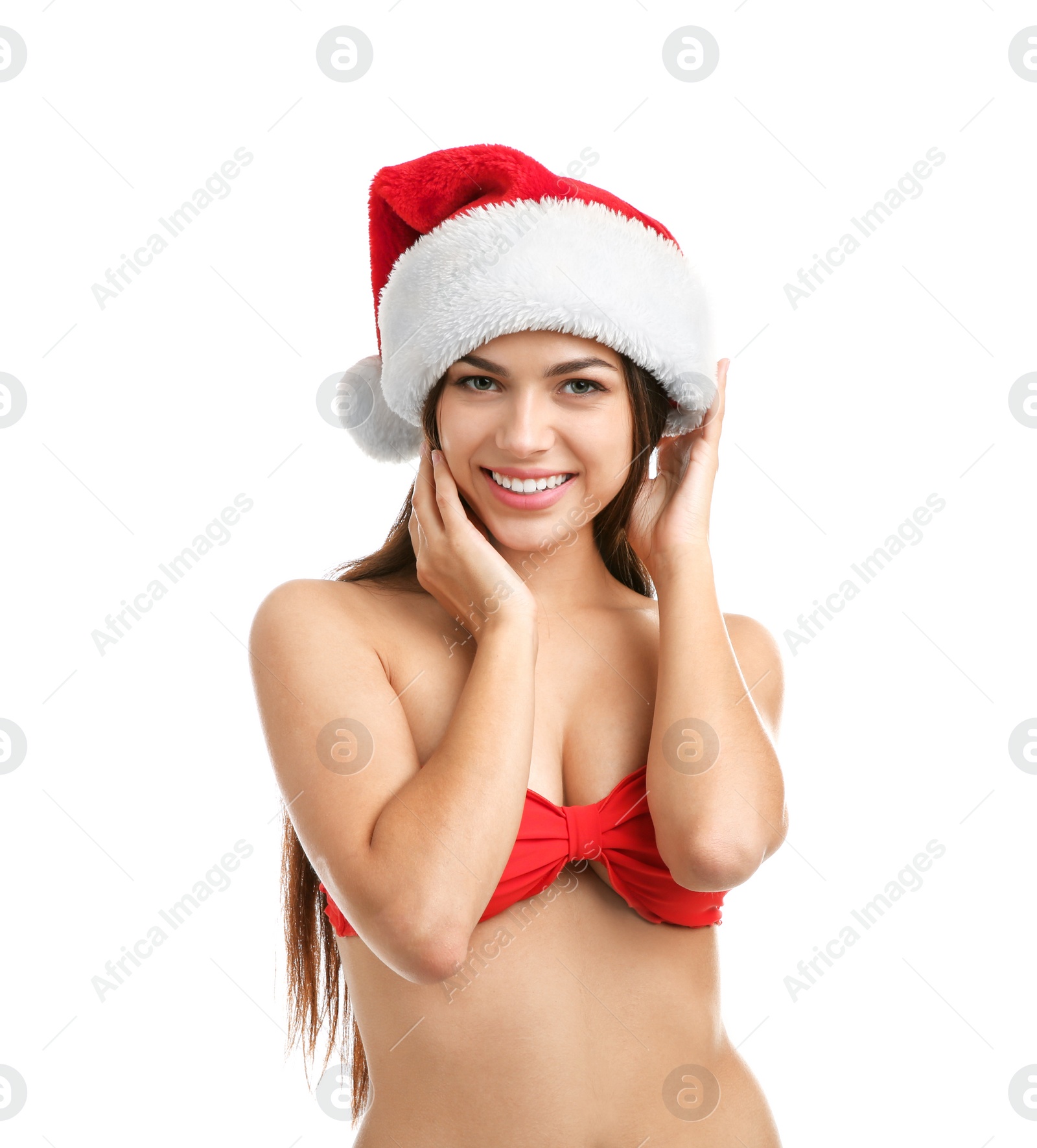 Photo of Young beautiful woman in swimsuit and Santa hat on white background. Christmas celebration