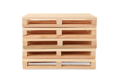Stack of small wooden pallets on white background