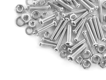 Photo of Many metal bolts and nuts on white background, top view