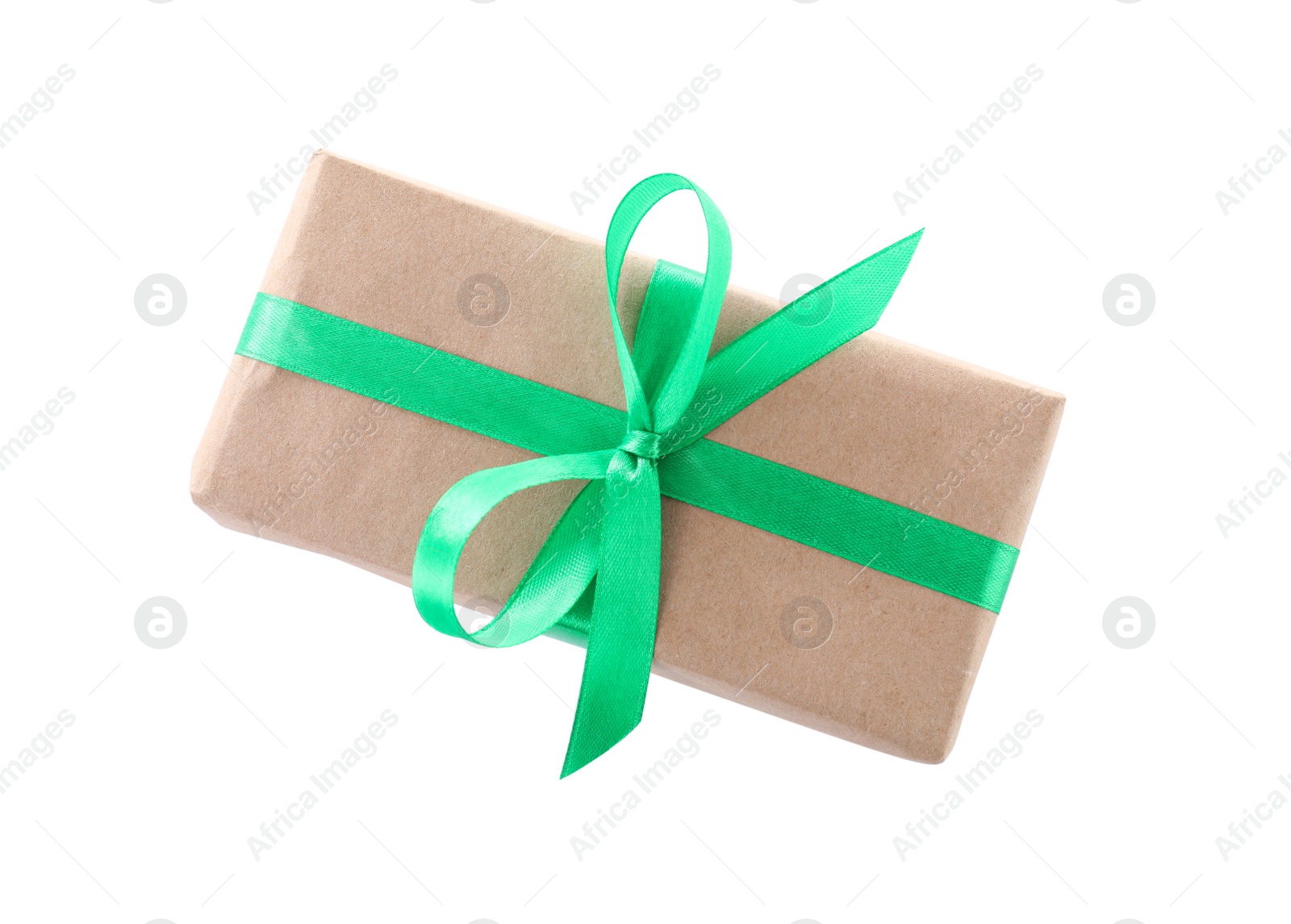 Photo of Christmas gift box decorated with ribbon bow on white background, top view