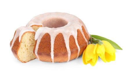 Traditional Easter cake and yellow tulips on white background