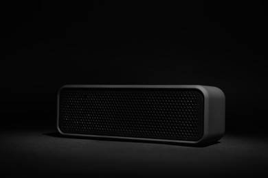 One portable bluetooth speaker on black background. Audio equipment