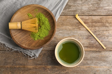 Flat lay composition with matcha tea on wooden background