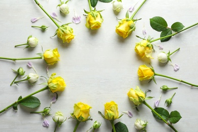 Photo of Flat lay composition with beautiful blooming flowers on light background