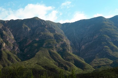 Picturesque landscape with high mountains under blue sky outdoors