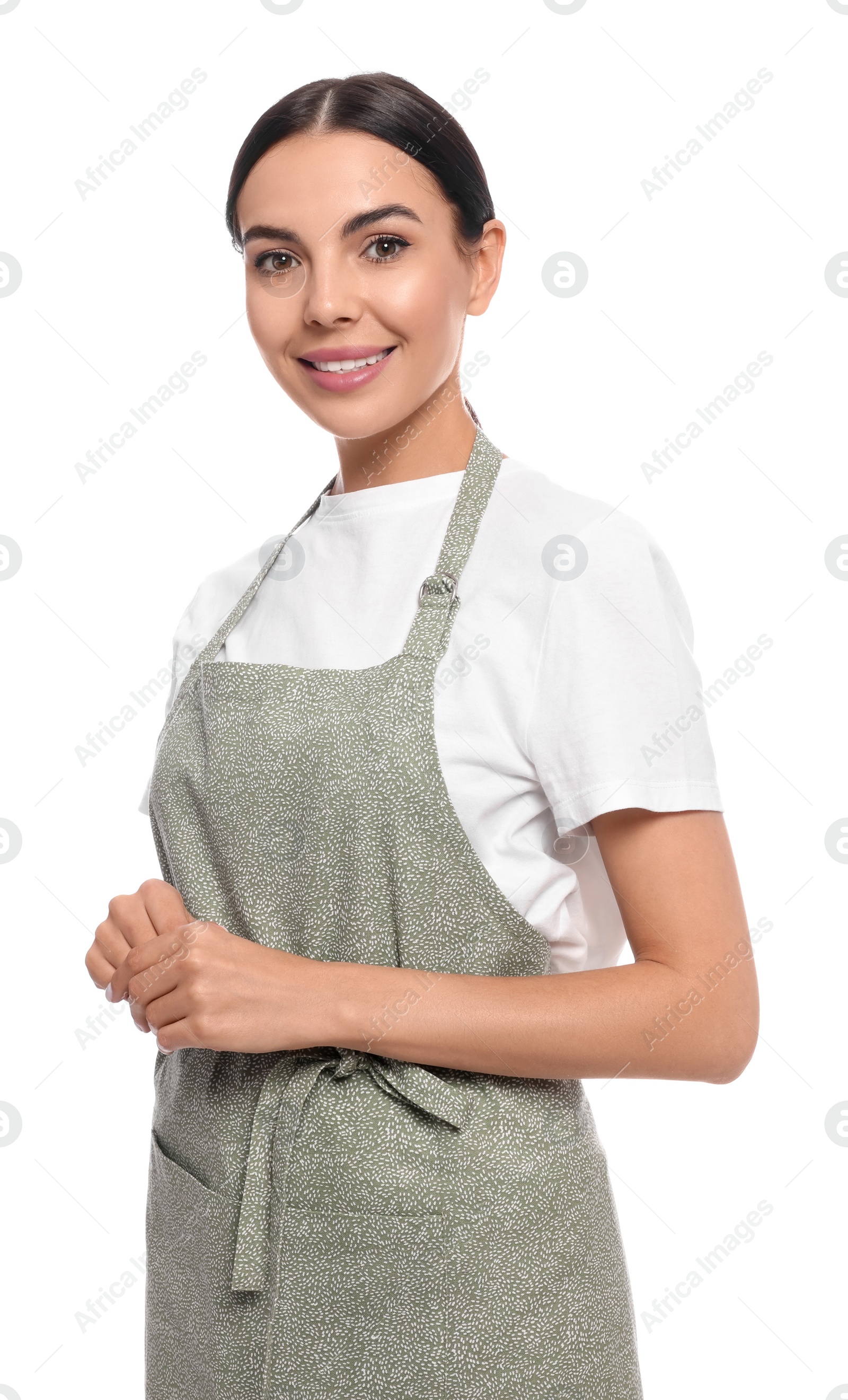 Photo of Young woman in light green apron on white background