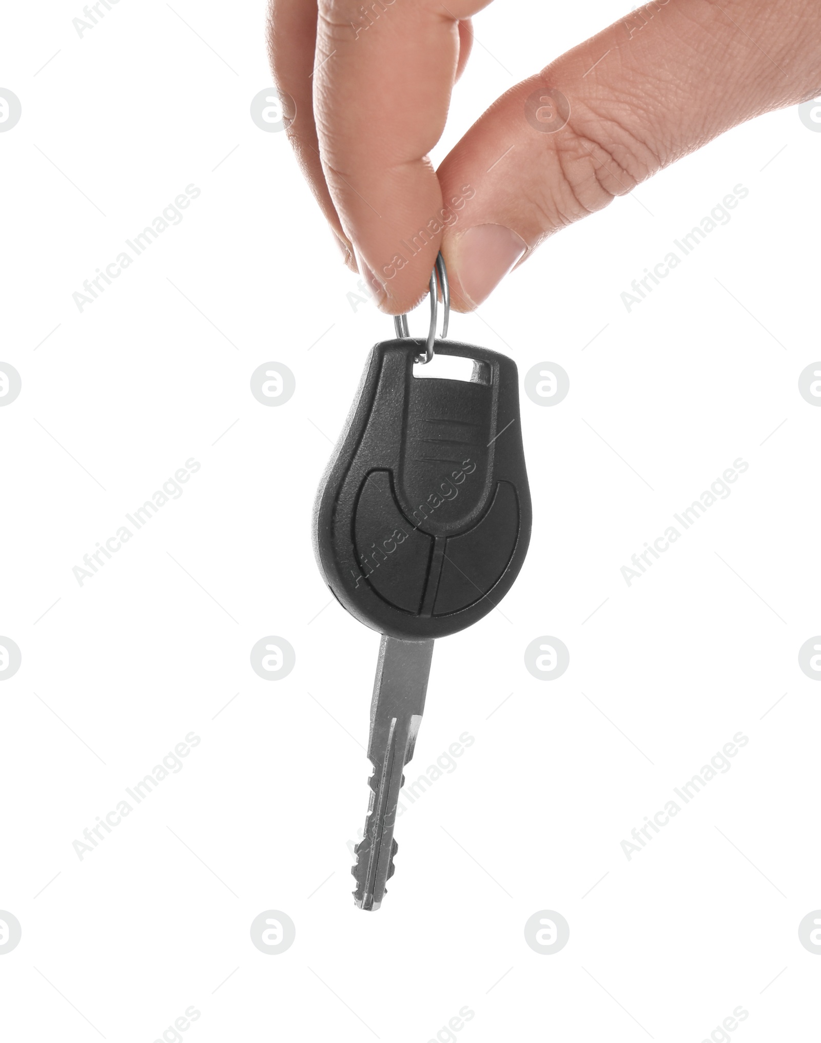 Photo of Man holding key on white background, closeup. Car buying