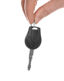 Photo of Man holding key on white background, closeup. Car buying