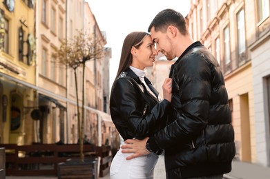 Photo of Lovely young couple enjoying time together outdoors. Romantic date