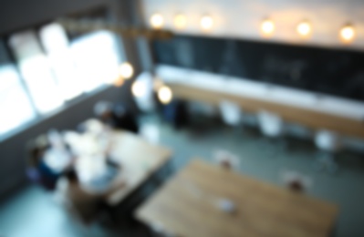 Photo of Blurred view of modern comfortable office interior