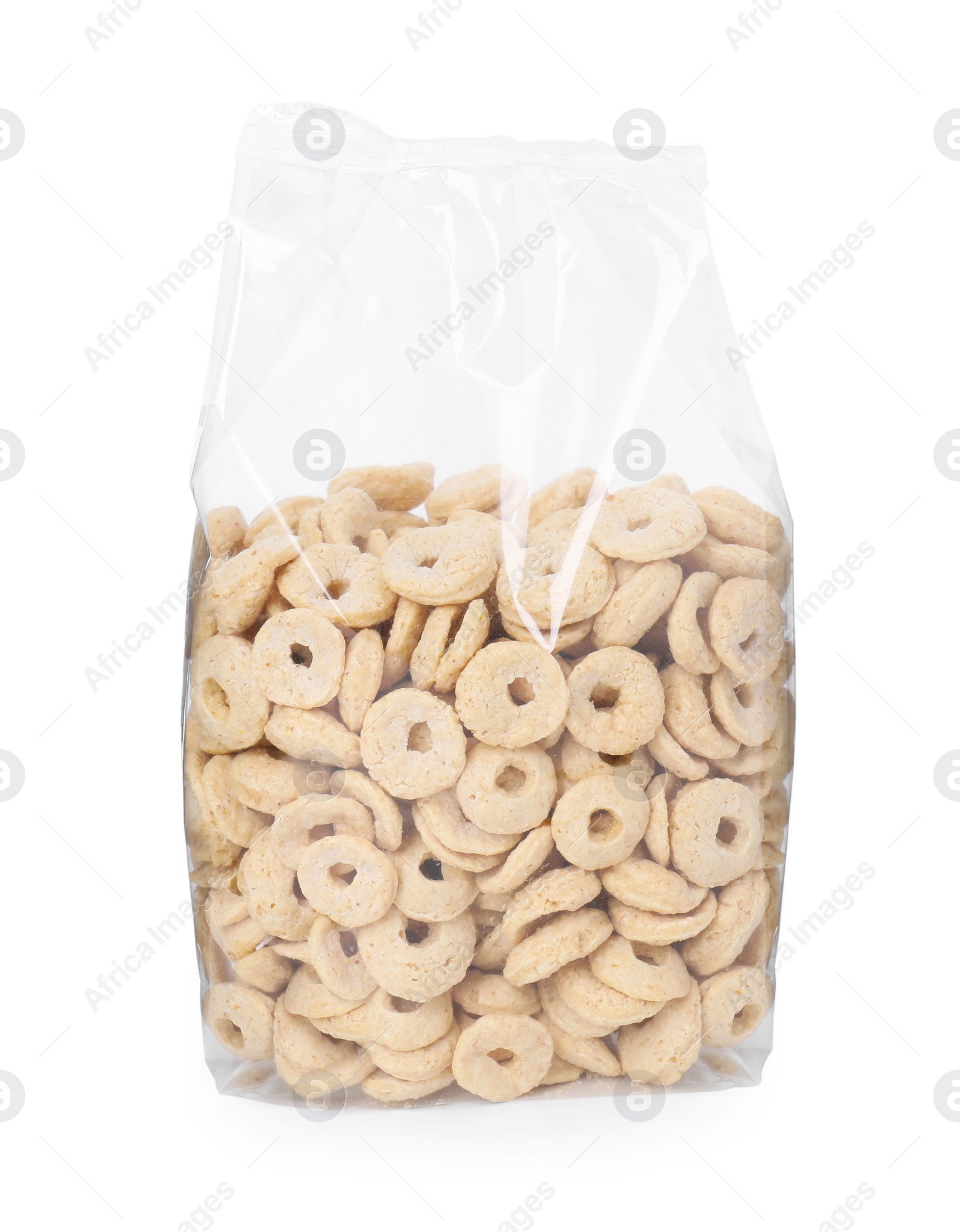 Photo of Tasty cereal rings in bag isolated on white