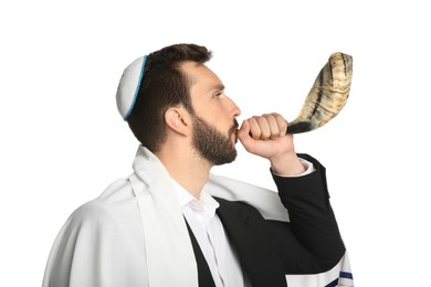 Photo of Jewish man with kippah and tallit blowing shofar on white background. Rosh Hashanah celebration