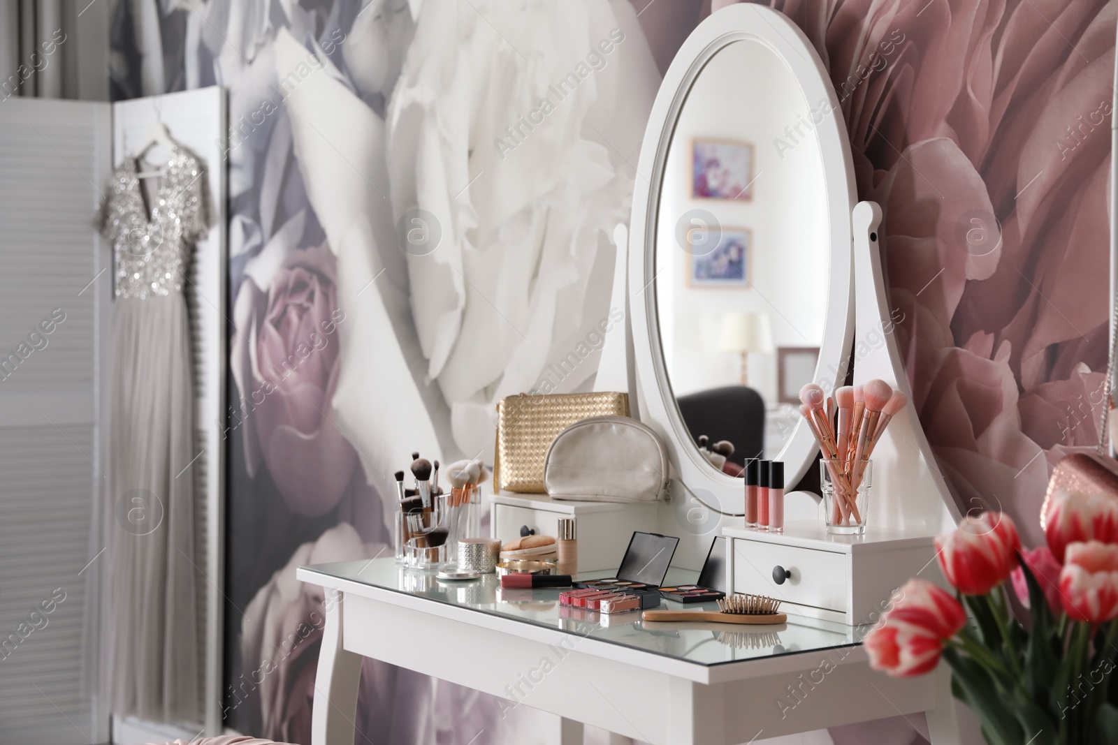 Photo of Stylish room interior with elegant dressing table and floral wallpaper