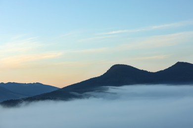 Photo of Beautiful mountain landscape with thick mist. Drone photography