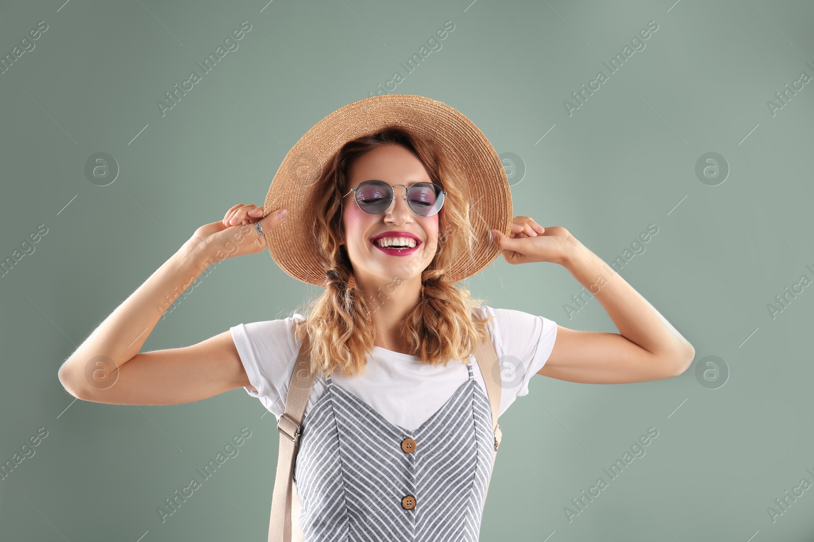 Photo of Beautiful young woman posing on color background. Summer fashion