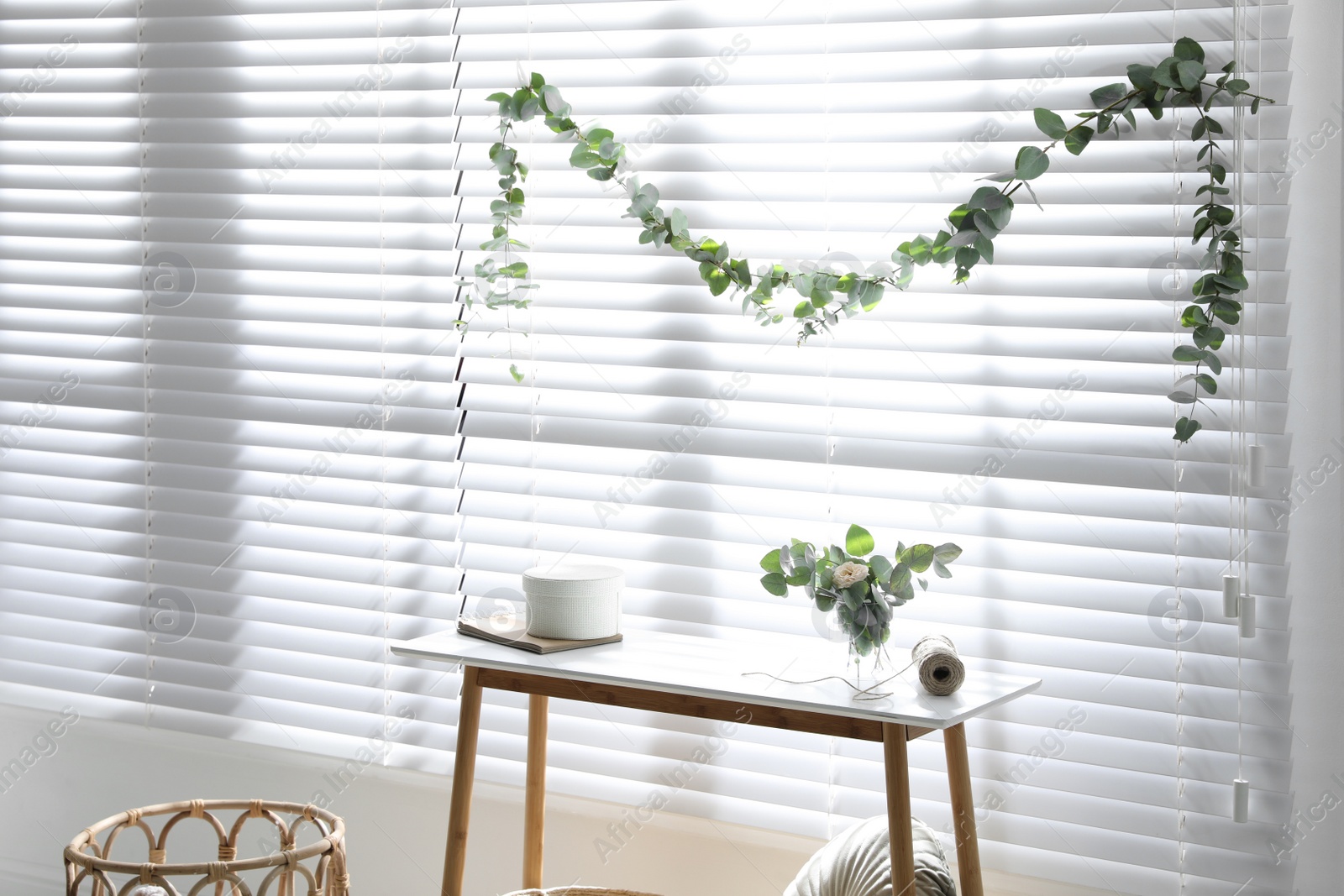 Photo of Stylish room decorated with beautiful eucalyptus garland