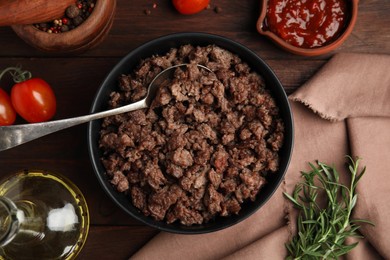 Photo of Fried minced meat and different products on wooden table, flat lay