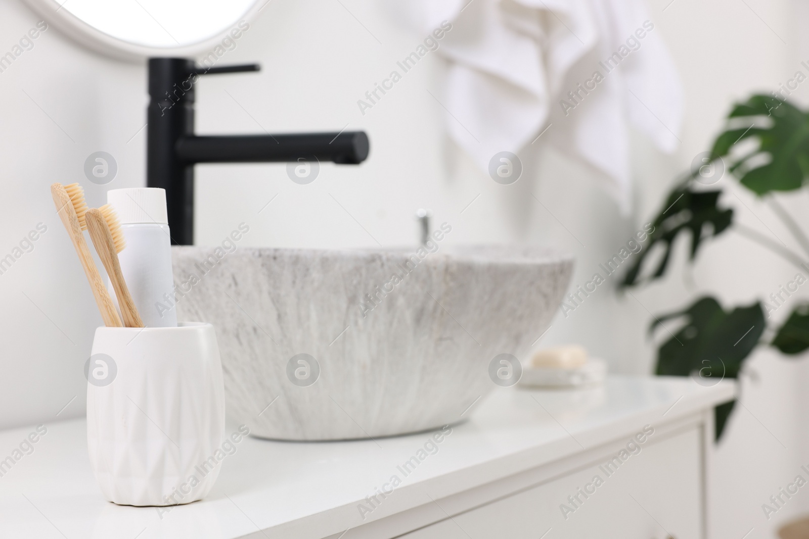 Photo of Bath accessories and personal care products on bathroom vanity indoors, space for text