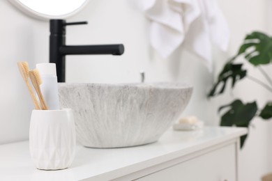Bath accessories and personal care products on bathroom vanity indoors, space for text